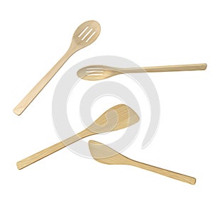 Wooden kitchen spatulas and spoons isolated photo